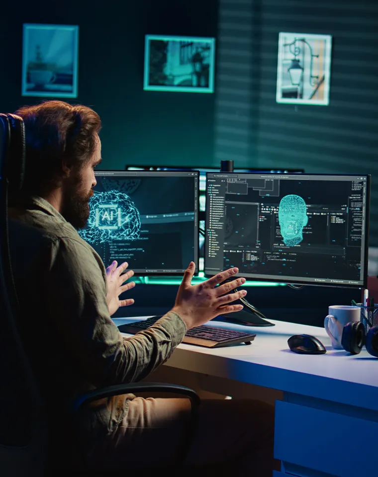Explainable AI with Python: How Enterprises in Healthcare: engineer working with AI interfaces on multiple monitors